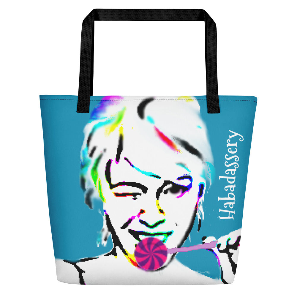 Image of turquoise tote bag by Habadassery with black cotton web handles. Tote bag shows art drawing of girl winking with a purple and pink lollipop. Printed text in white reads Habadassery.